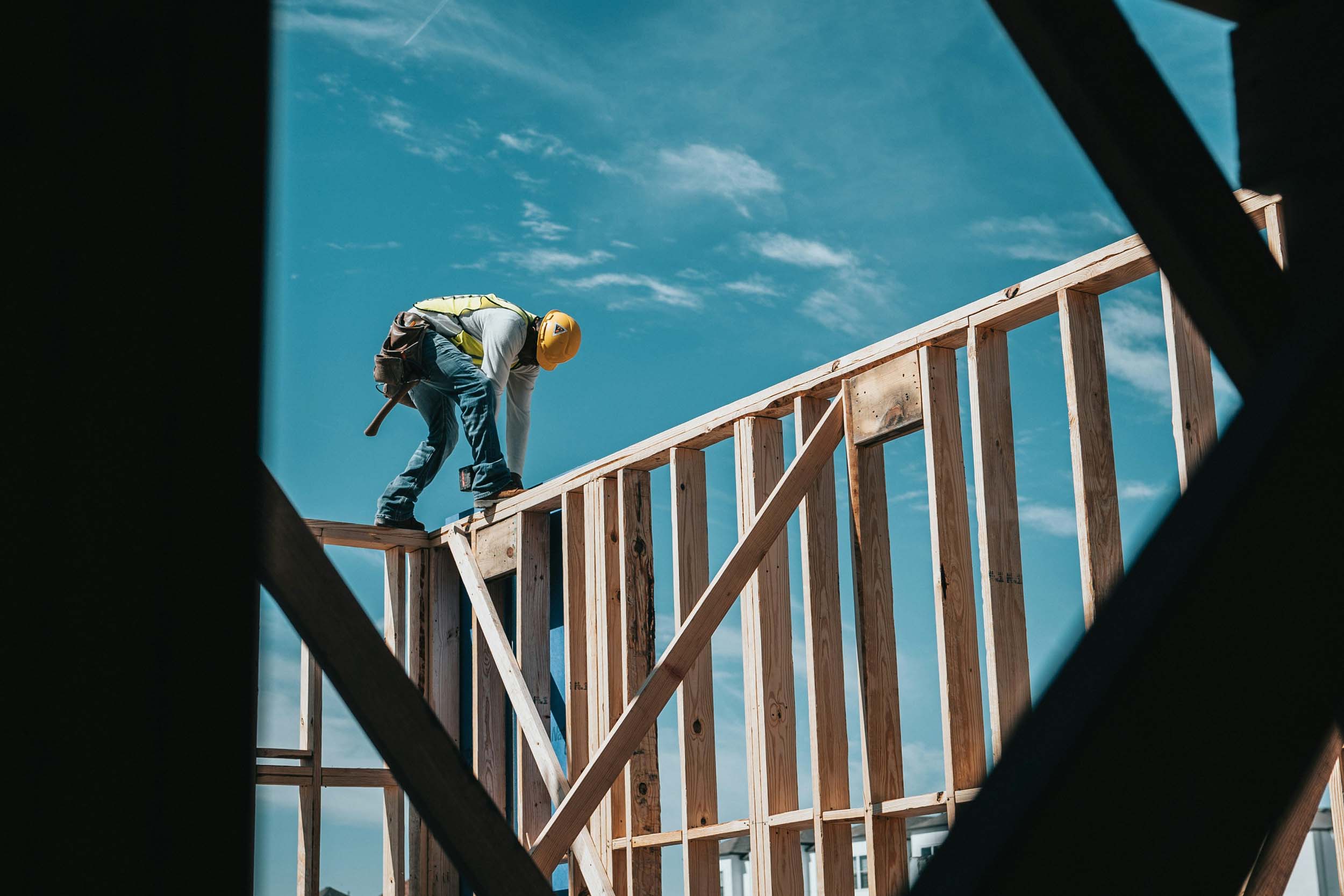 Construction worker working on frame